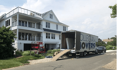 Moving Services for a Large White House With A Collegian Movers In CT Truck Outside.