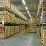 Boxes stacked on racks in a moving storage warehouse