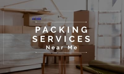 Packing Services Near Me By Collegian Moving Companies in CT. With An Blurry Graphic of A Room Packed To Move, Wrapped Sofa, Packed Boxes, Rolled Rug Ready For Transport, Table and Bookshelves