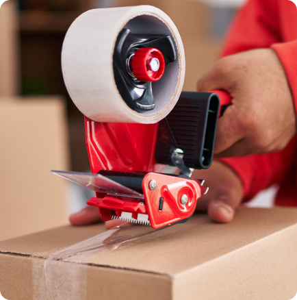 A mover packing a box