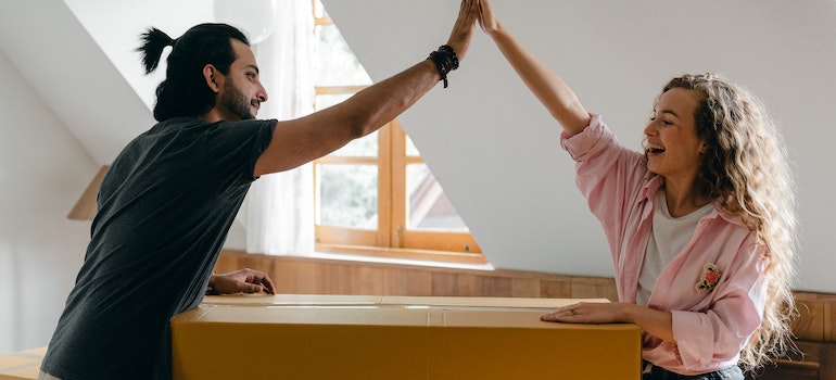 A couple giving high five to one another