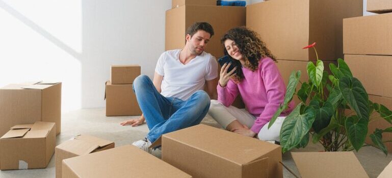 A man and woman sitting and waiting for movers in Wallingford CT