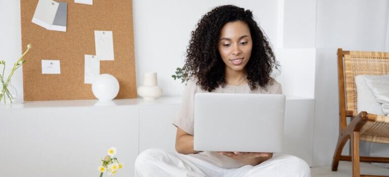 woman reading about Why Is Moving Insurance Important on her laptop