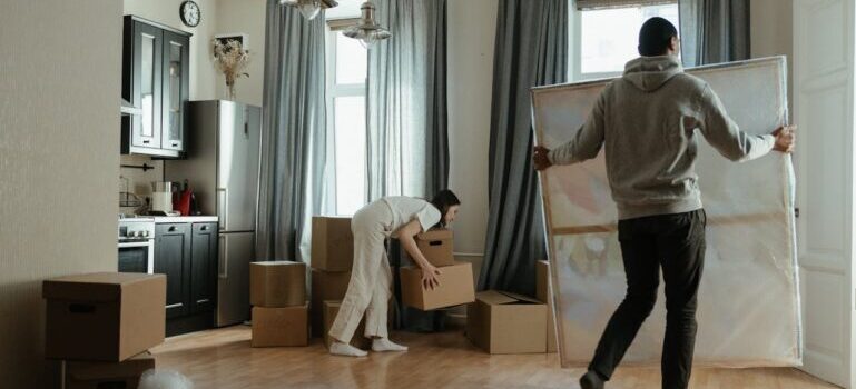 man and woman packing things after reading about the main reasons people rent storage in Connecticut