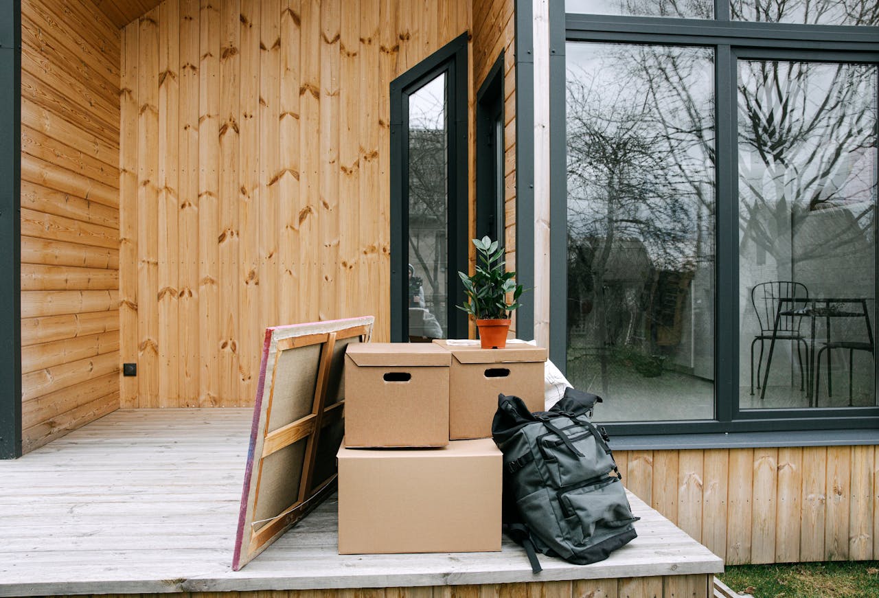 boxes and stuff over the wooden porch