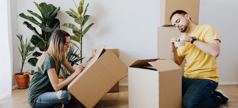 People in home packing for a move