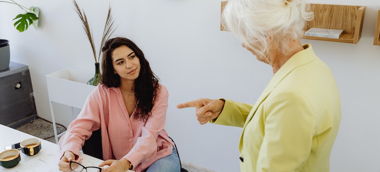 A woman helping her senior parent move