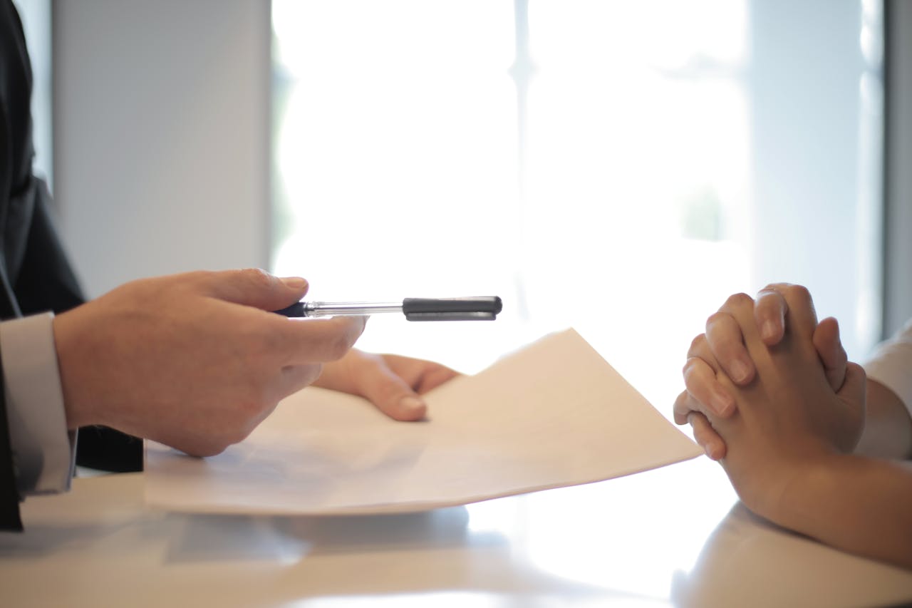 man giving contract to a woman