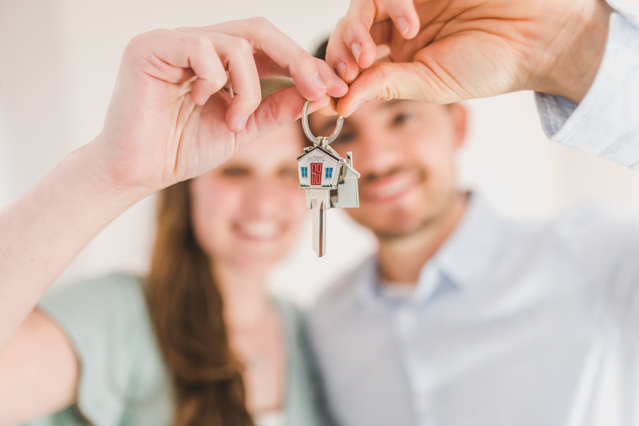 happy couple holding keys