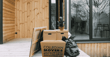 moving boxes and household goods on a wooden porch in Monroe CT