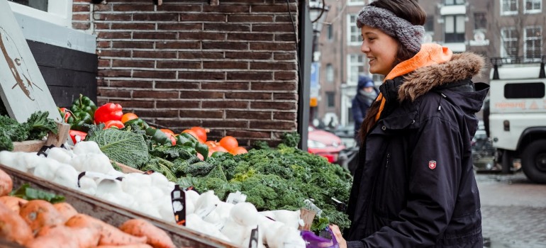 A woman talking with a vendor