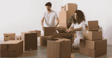 A couple using the best ways to pack your items for storage in Milford