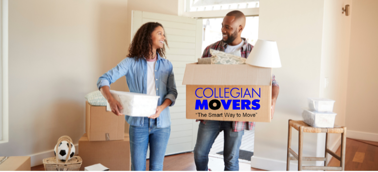 A happy couple unpacks boxes in their new Milford apartment. Moved in just hours after calling Collegian Movers for same-day service.