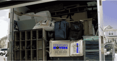 moving truck filled with packed boxes and household goods: utilizing packing services