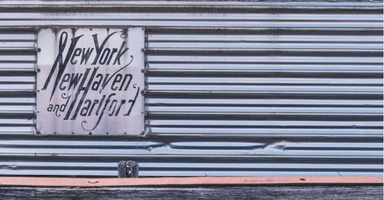 Side view of a train with a sign reading New York, New Haven and Hartford.