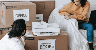 Clients packing up their home in labeled boxes