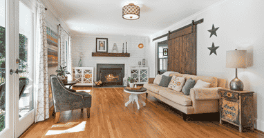 Living room with sofa, chair and fireplace