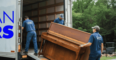 Collegian Movers, the top piano movers in CT, using a professional piano board.
